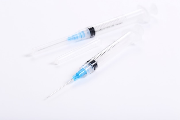 Syringes with blue liquids