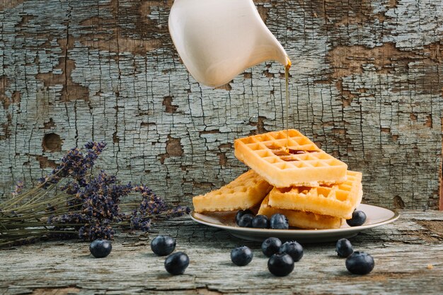 Syrup flowing on waffles