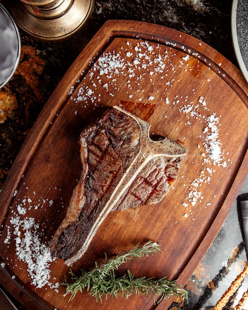 T bone steak topped with salt