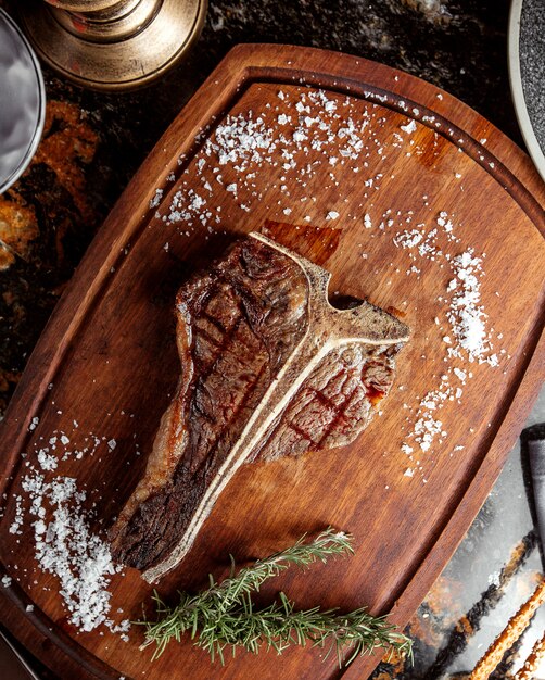 T bone steak topped with salt