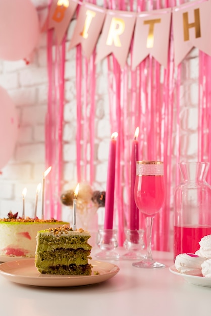 Table arrangement for birthday event with cake and glass of champagne