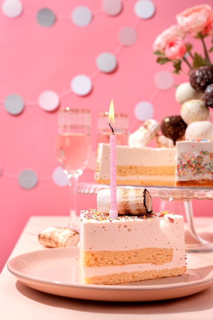 Table arrangement for birthday event with cake and glasses of champagne