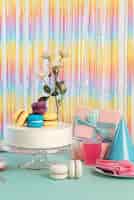Free photo table arrangement for birthday event with cake and rose
