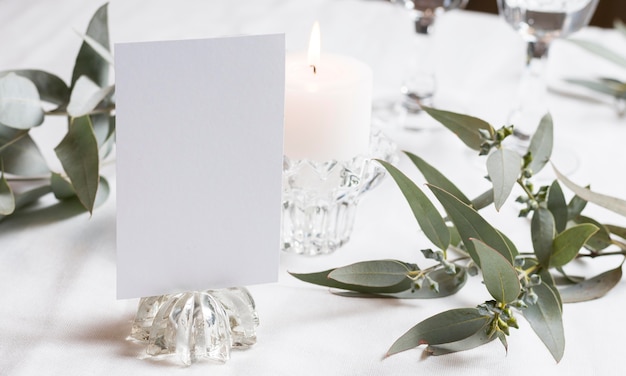 Table arrangement with candle and plants