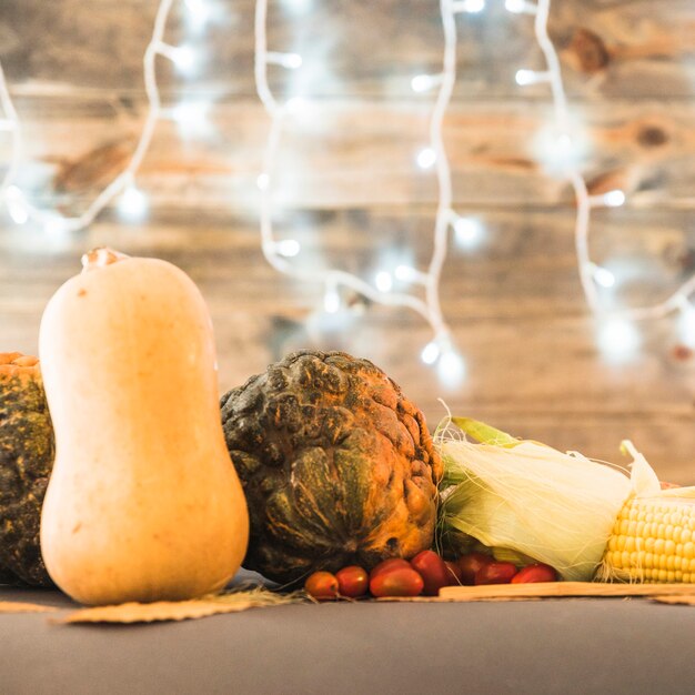 Free photo table covered with big pumpkins