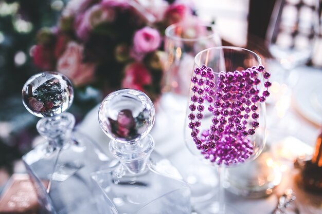 Table decorated for christmas with a glass