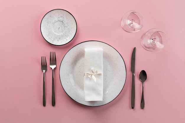 Table etiquette with pink background top view