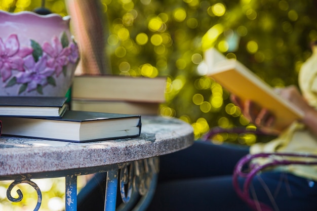 Free photo table in garden with textbooks in it