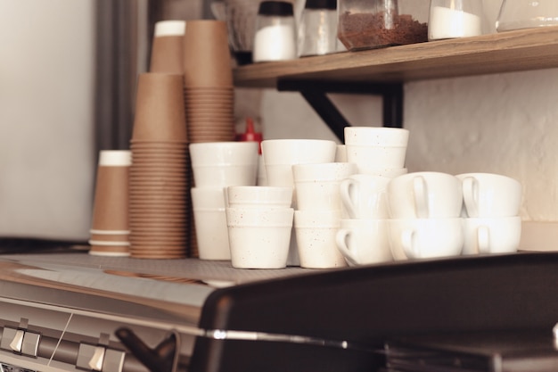 A table setting for coffee on the counter at a coffee house