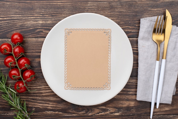 Table setting with tomatoes beside