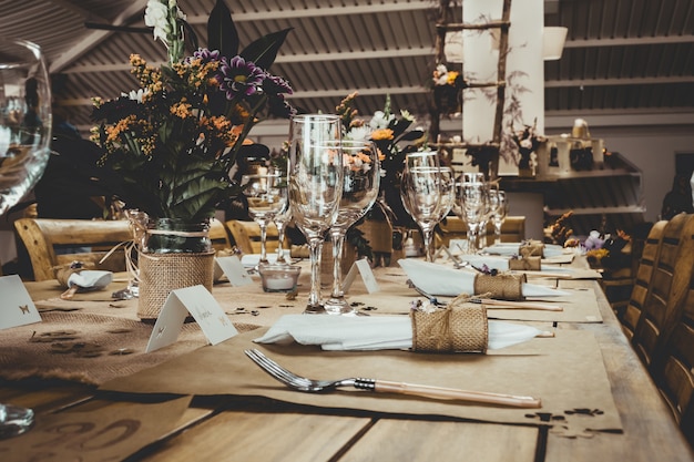 Table with flowers in pots in the restaurant