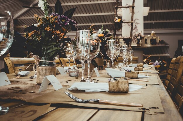 Table with flowers in pots in the restaurant