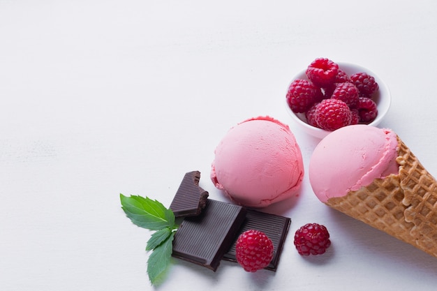Table with raspberries ice cream