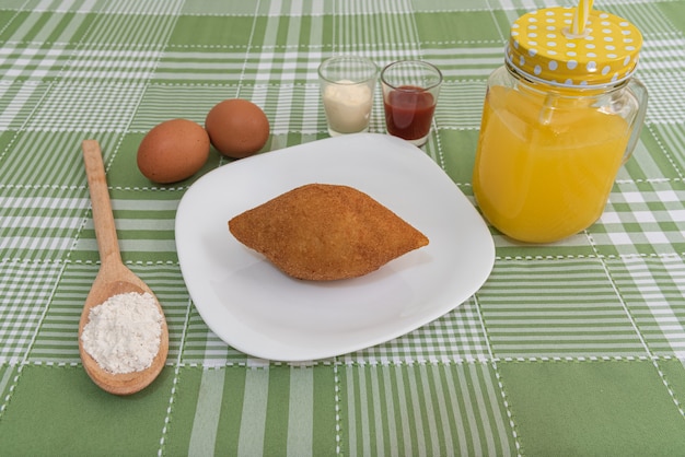 Table with several Brazilian snacks