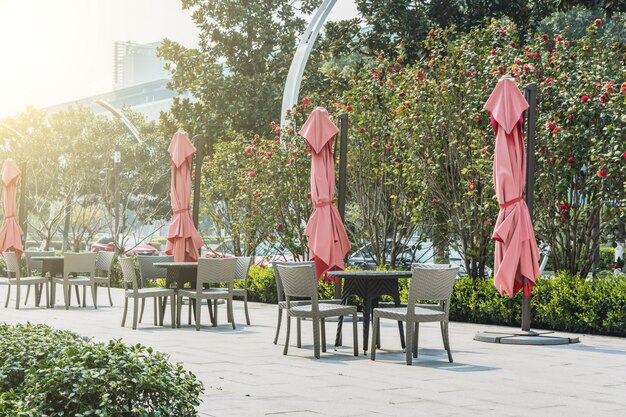 Tables and chairs with umbrellas