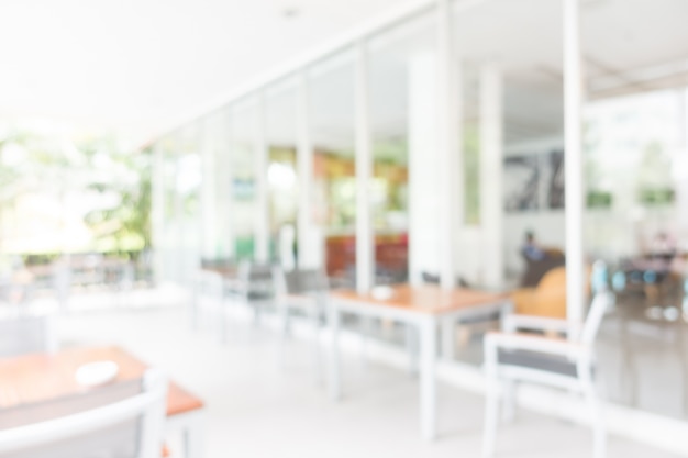 Tables with gray chairs unfocused abroad