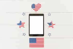 Free photo tablet and holiday decoration of us flag