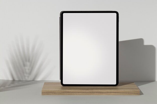 Tablet minimal display on wooden board