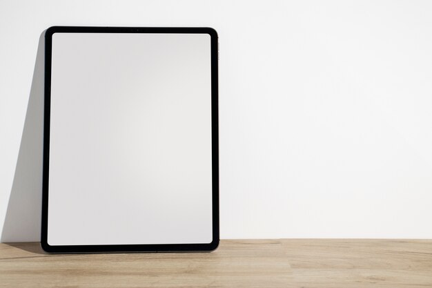 Tablet minimal display on wooden surface