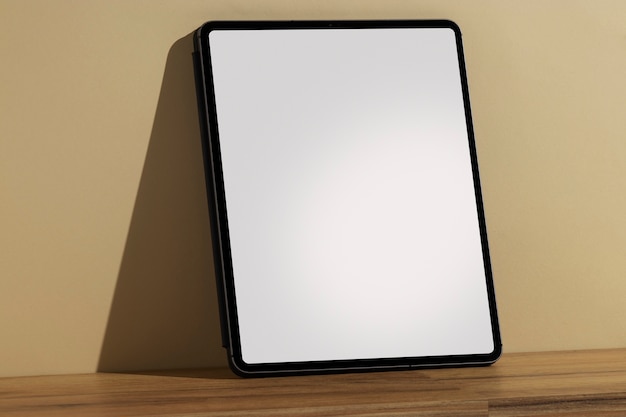 Tablet minimal display on wooden surface