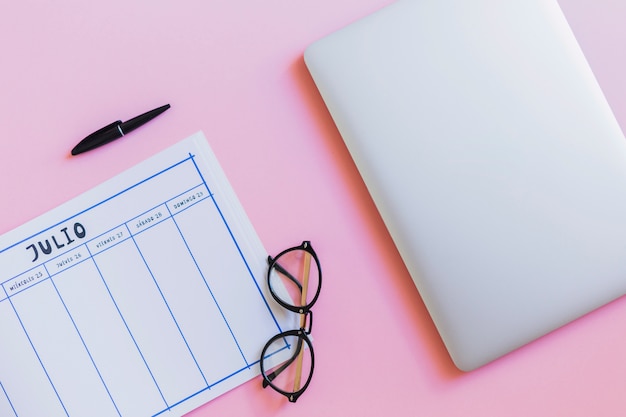 Tablet near smartphone, eyeglasses and calendar