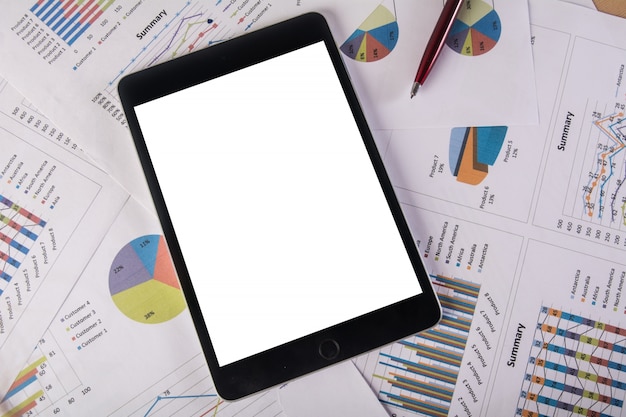 Tablet with blank screen over business chart. Copy space. Business concept.v