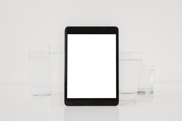 Tablet with glasses of water