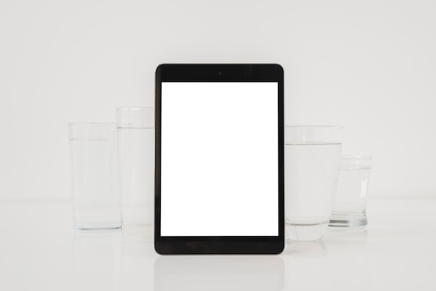 Tablet with glasses of water