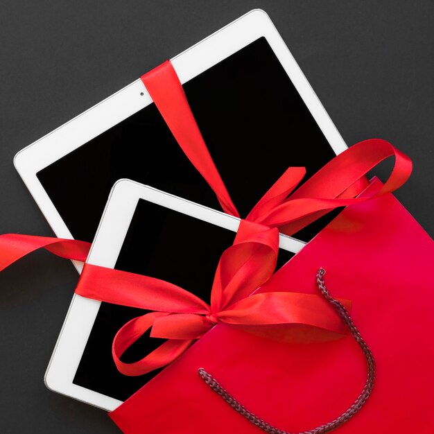 Tablets with ribbons in red packet
