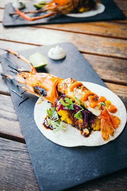 Free photo taco with prawn or shrimp and sauce