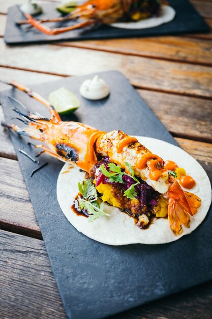 Taco with prawn or shrimp and sauce