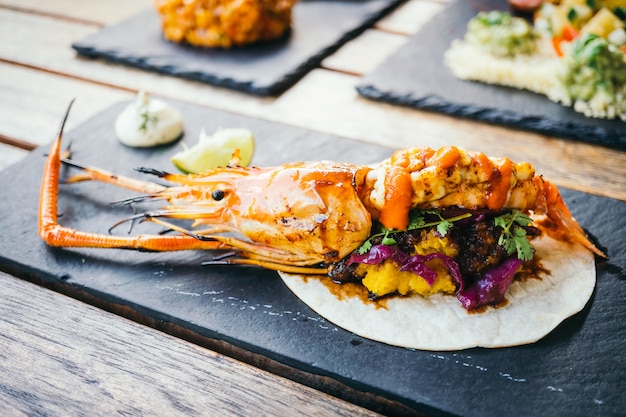 Taco with prawn or shrimp and sauce