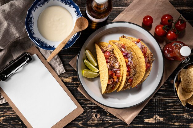 Tacos with vegetables and meat flat lay