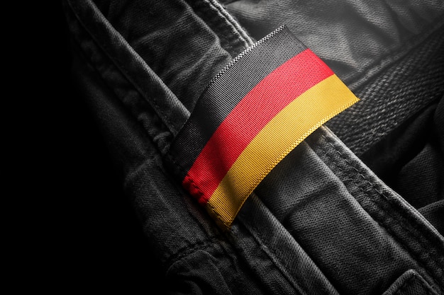 Tag on dark clothing in the form of flag of Germany.