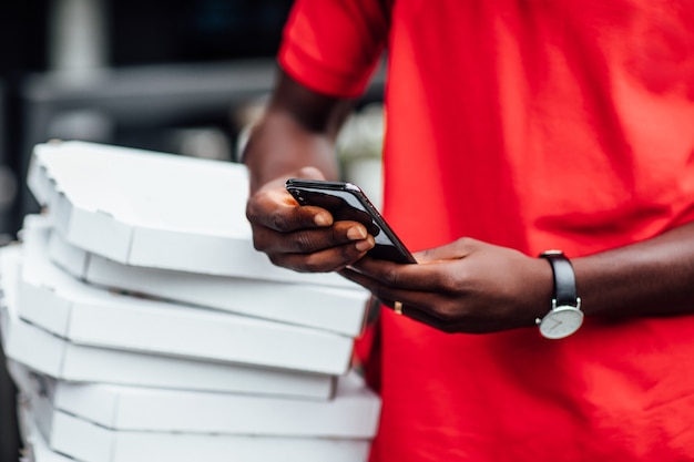 Free photo take your order. close up photo. man work with pizza.