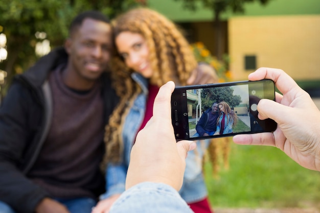 Taking photo of afro american couple