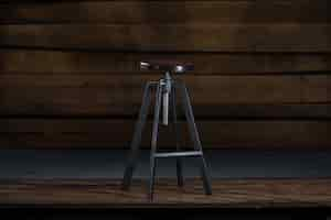 Free photo tall bar stool on a wooden background