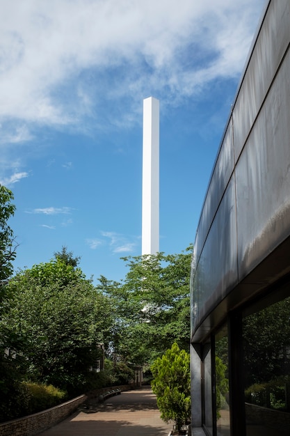 Tall chimney surrounded by nature