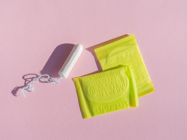 Free photo tampon and pads in wrapping yellow plastic