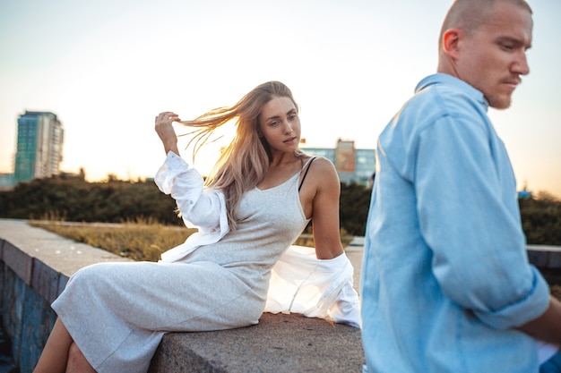 Tanned young caucasian couple, modern lovestory in film grain effect and vintage style.