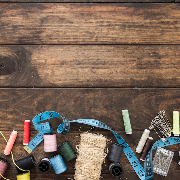 Free photo tape measure amidst threads and pins