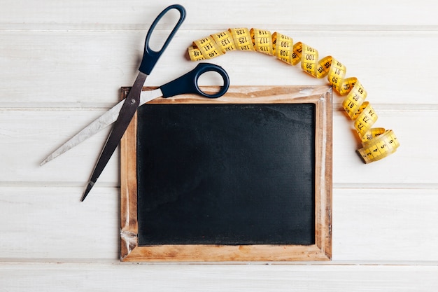 Tape measure, scissors and slate