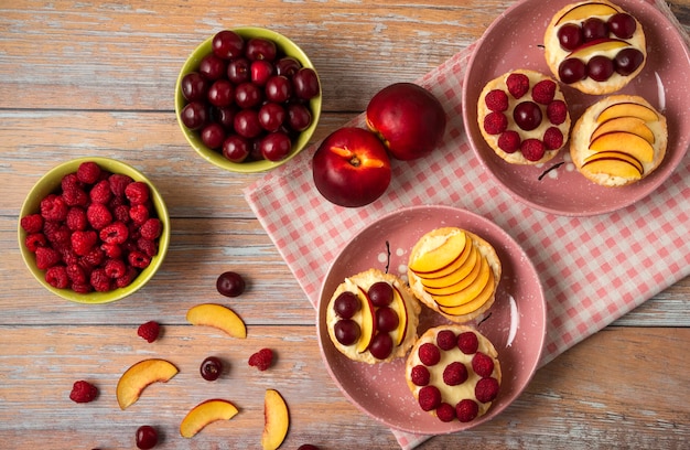 Tartalettes with summer fruits on them, top view