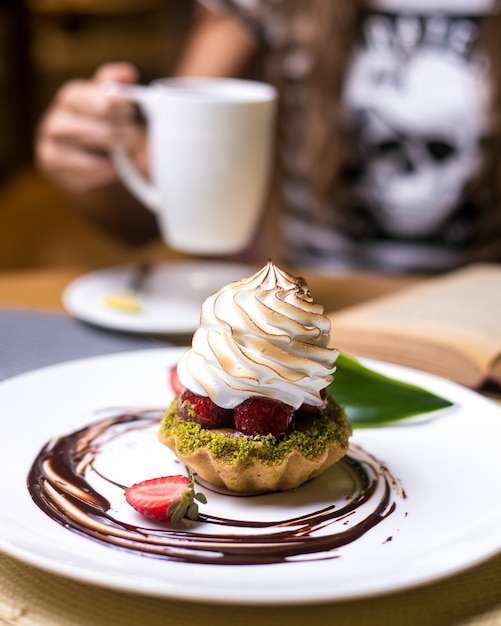 Tartlets with pistachios strawberry cream chocolate side view