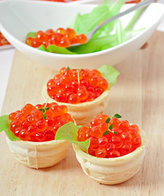 Tartlets with red caviar