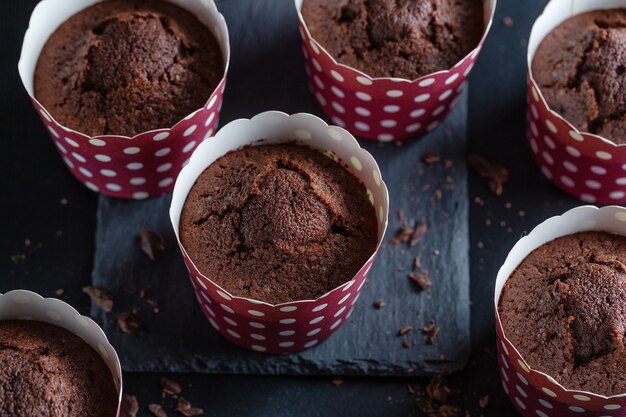 Tasty appetizing chocolate muffins in cups.