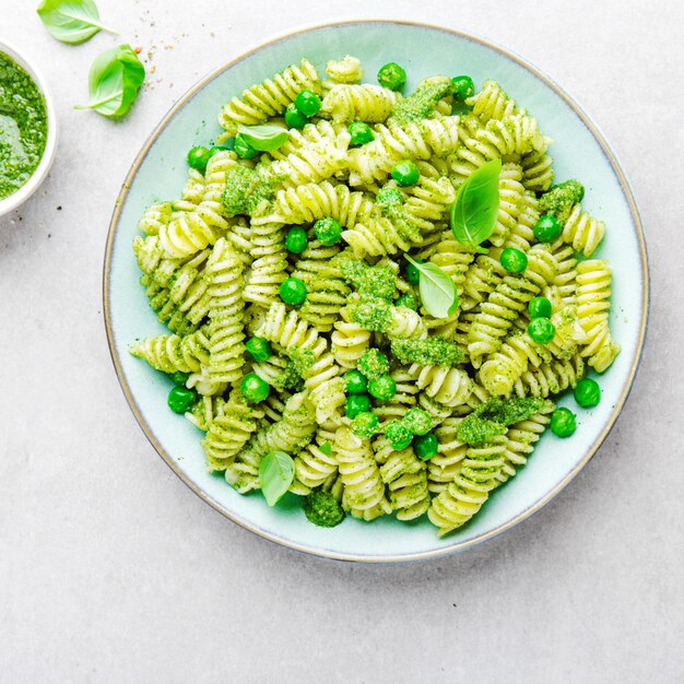 Tasty appetizing pasta with pesto on plate