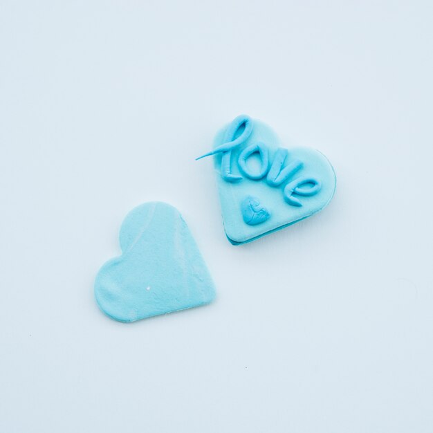 Tasty azure cookies in form of hearts