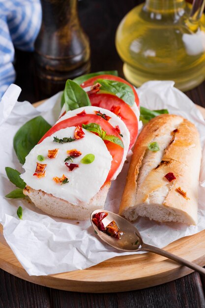 Tasty baguette with mozzarella on a plate