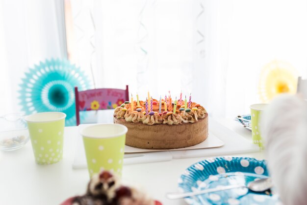 Tasty birthday cake on table